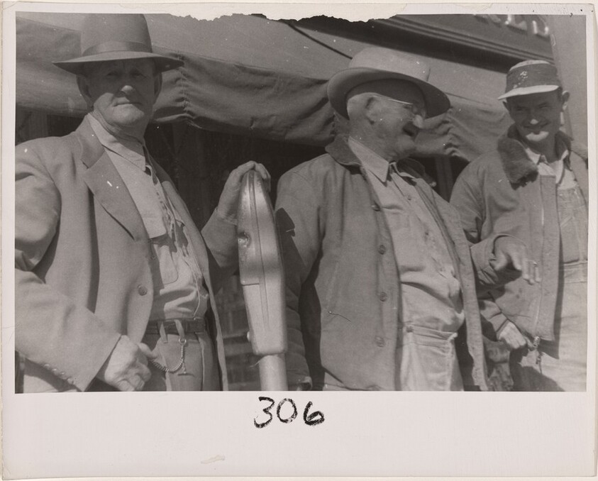 Three men near parking meter--Alabama