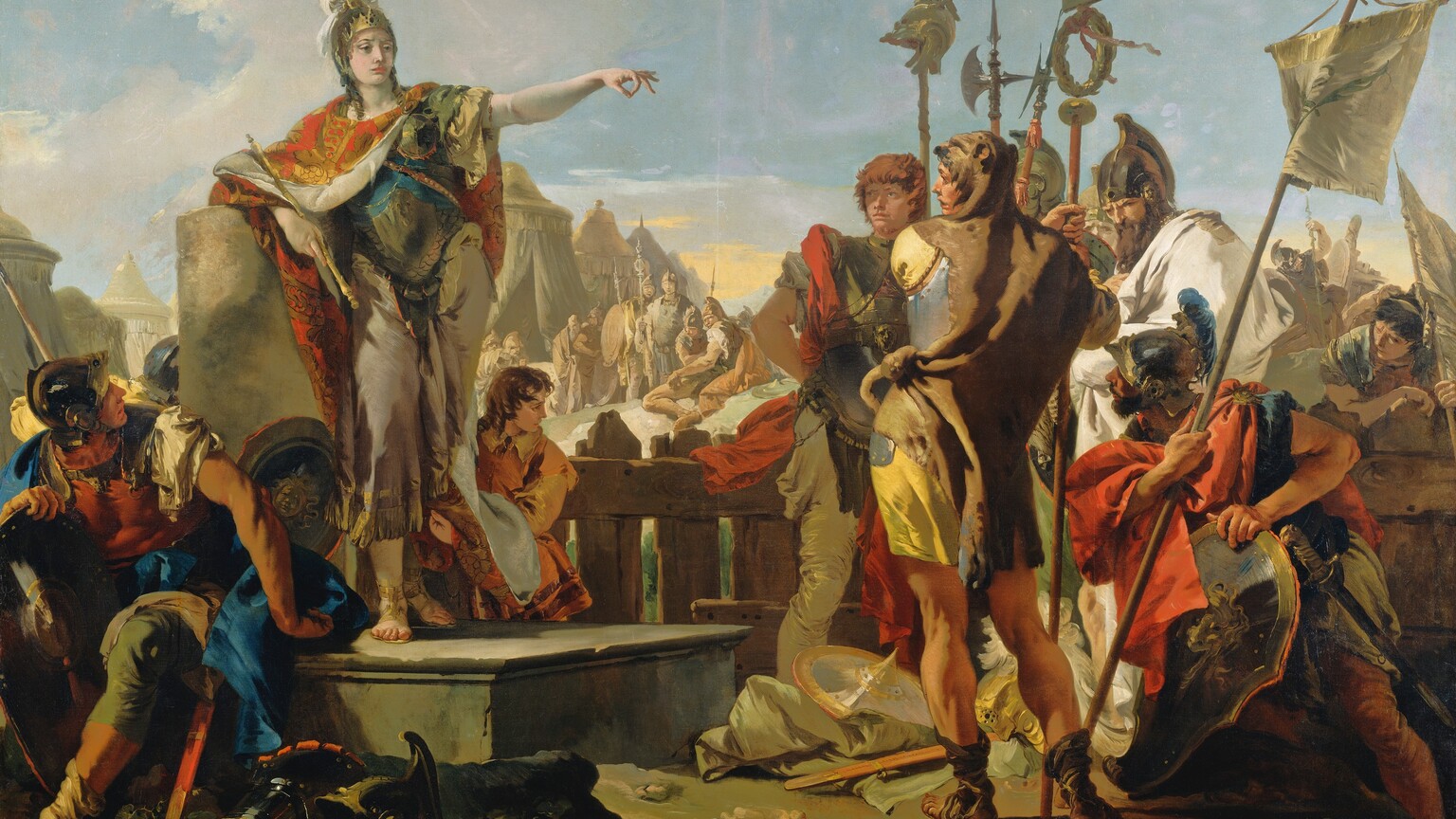 A woman wearing a breastplate and helmet over a toga stands to our left on a platform, gesturing with one arm extended to a group of about a dozen soldiers gathered around her in this horizontal painting. The woman has pale white skin and most of the soldiers have ruddy complexions. The woman stands with her body facing us but she turns her head to our right, looking toward but not at the knot of soldiers clustered there. She leans on her right elbow, on our left, resting on the flat top of a broken column, and she holds a scepter in that hand. Her other arm is raised and her fingers are extended except for the index finger and thumb, which touch to make a circle. Her gold helmet is encrusted with gems and a white plume issues from the top. Her red and gold cloak is fastened around her neck and falls open to reveal her armor and sandal-clad feet. A shield rests on the platform near her feet, and other pieces of armor are scattered on the dirt ground near the platform. A young boy with chestnut-brown curls holds her cloak behind her and to our right. In the lower left corner of the painting, one soldier sits on the edge of the platform, and he twists and looks up at the woman. Several soldiers standing in a group to our right carry shields, banners, and halberds, which are tall, ax-like weapons. The men wear helmets and breastplates, and cloaks in canary yellow, crimson red, and ivory white. The man closest to us stands with his back to us, and he looks over his shoulder at the woman. An animal skin wraps around his shoulders and the head of the animal drapes over his head. More soldiers and tents in the middle distance are painted in almost monochromatic tones of peanut brown and taupe. The sky above is blue with a few white clouds, except for a band of soft yellow along the horizon.