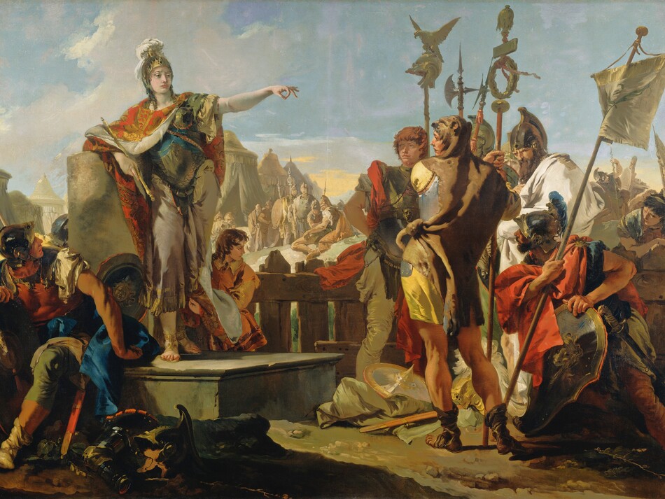 A woman wearing a breastplate and helmet over a toga stands to our left on a platform, gesturing with one arm extended to a group of about a dozen soldiers gathered around her in this horizontal painting. The woman has pale white skin and most of the soldiers have ruddy complexions. The woman stands with her body facing us but she turns her head to our right, looking toward but not at the knot of soldiers clustered there. She leans on her right elbow, on our left, resting on the flat top of a broken column, and she holds a scepter in that hand. Her other arm is raised and her fingers are extended except for the index finger and thumb, which touch to make a circle. Her gold helmet is encrusted with gems and a white plume issues from the top. Her red and gold cloak is fastened around her neck and falls open to reveal her armor and sandal-clad feet. A shield rests on the platform near her feet, and other pieces of armor are scattered on the dirt ground near the platform. A young boy with chestnut-brown curls holds her cloak behind her and to our right. In the lower left corner of the painting, one soldier sits on the edge of the platform, and he twists and looks up at the woman. Several soldiers standing in a group to our right carry shields, banners, and halberds, which are tall, ax-like weapons. The men wear helmets and breastplates, and cloaks in canary yellow, crimson red, and ivory white. The man closest to us stands with his back to us, and he looks over his shoulder at the woman. An animal skin wraps around his shoulders and the head of the animal drapes over his head. More soldiers and tents in the middle distance are painted in almost monochromatic tones of peanut brown and taupe. The sky above is blue with a few white clouds, except for a band of soft yellow along the horizon.