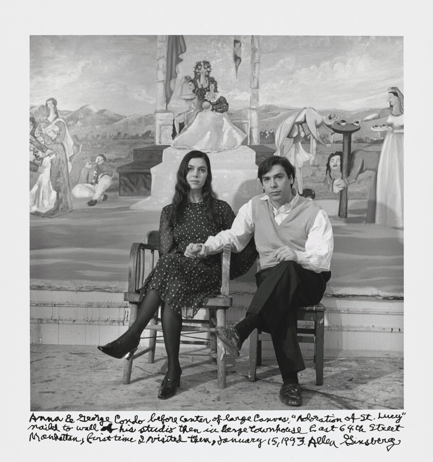 Anna & George Condo before center of large canvas, "Adoration of St. Lucy" nailed to wall of his studio then in large townhouse East 64th Street Manhattan, first time I visited them, January 15, 1993.