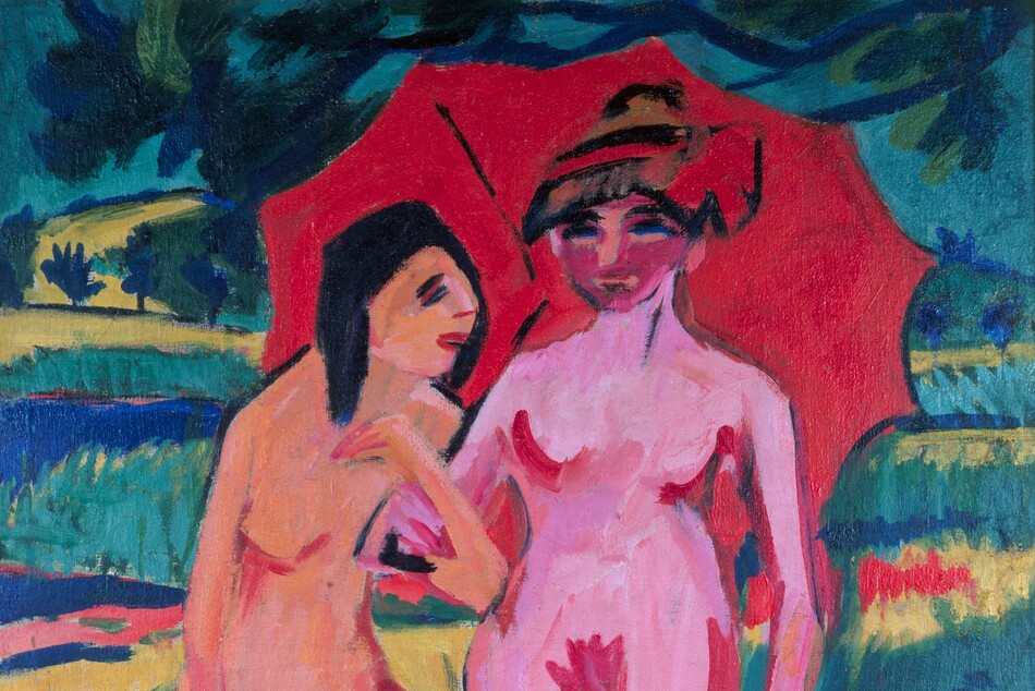 Two nude women, painted in vibrant coral peach and bubblegum pink, stand under a red umbrella in a landscape in this stylized, vertical painting. The scene is painted with areas of flat or streaked color with visible brushstrokes throughout. The women and umbrella take up most of the picture. The woman on our left stands facing our right almost in profile. Her skin is vivid peach. Slashes of red outline her breasts, groin, and legs. Her hair, eyes, and eyebrows are painted with black strokes. She stands on one leg and stretches the other in front of her to overlap the far foot of the other woman. The first woman hooks her arm through the elbow of the other, who stands facing us to our right. This second woman has vivid pink skin also outlined in red. Her face is a darker shade of pink, resembling a mask, and her eyes are parallel strokes of black and blue. Her left arm, on our right, hangs by her side, and she holds the umbrella with the other arm. She either wears a hat or her hair is painted with alternating bands of black, red, and brown, and there is a red flower or bow to one side. Black lines in the candy-red umbrella suggest a rib on the underside and the handle. Cobalt-blue branches of a tree above the women has blue and green leaves. The landscape beyond them is made up of bands of acid green, yellow, saturated blue, and cool green.