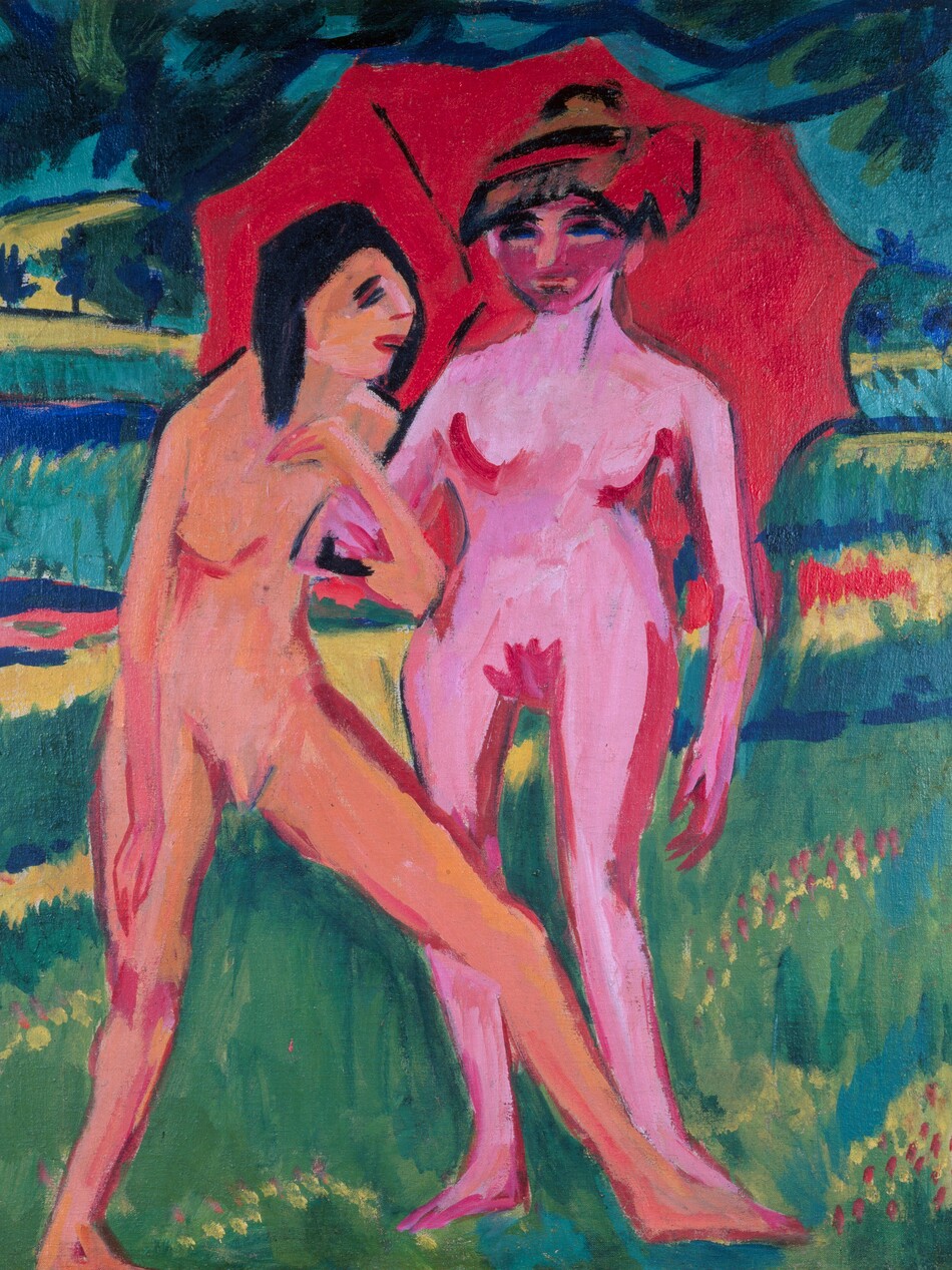 Two nude women, painted in vibrant coral peach and bubblegum pink, stand under a red umbrella in a landscape in this stylized, vertical painting. The scene is painted with areas of flat or streaked color with visible brushstrokes throughout. The women and umbrella take up most of the picture. The woman on our left stands facing our right almost in profile. Her skin is vivid peach. Slashes of red outline her breasts, groin, and legs. Her hair, eyes, and eyebrows are painted with black strokes. She stands on one leg and stretches the other in front of her to overlap the far foot of the other woman. The first woman hooks her arm through the elbow of the other, who stands facing us to our right. This second woman has vivid pink skin also outlined in red. Her face is a darker shade of pink, resembling a mask, and her eyes are parallel strokes of black and blue. Her left arm, on our right, hangs by her side, and she holds the umbrella with the other arm. She either wears a hat or her hair is painted with alternating bands of black, red, and brown, and there is a red flower or bow to one side. Black lines in the candy-red umbrella suggest a rib on the underside and the handle. Cobalt-blue branches of a tree above the women has blue and green leaves. The landscape beyond them is made up of bands of acid green, yellow, saturated blue, and cool green.