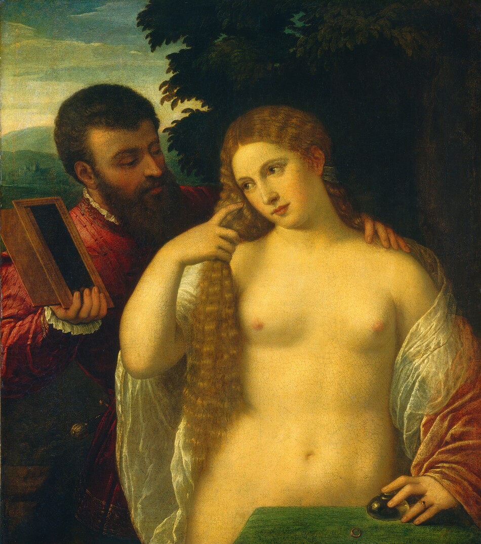 Shown from the hips up, a nude woman stands between a table in front of her and a clothed man behind her, against a deep landscape in this vertical painting. The man rests one hand on her shoulder and holds up a mirror with the other. The woman’s pale skin has a pronounced golden glow. Her body faces us and she looks to our left, holding her waist-length, curly, strawberry-blond hair with her right hand by her face. Her hair on the other side is tied back with a sage-green band behind her ear. She wears a sheer white sash wrapped around her back and upper arms. A muted rose-pink, velvet sash loops over her left forearm, to our left. That hand rests on a round, squat glass bottle that sits on a leaf-green table, with her index finger covering the opening of the bottle. She wears a gold ring with a small dark stone on her left ring finger, and another gold ring rests on the table. The back corner of the table covers her genitals in the lower right corner of the painting. Behind her and to our left, a man with an olive-toned complexion and short curly brown hair, moustache, and long beard looks down his long nose at the woman as he rests his left hand, to our right, on her shoulder. He has dark eyebrows, flushed cheeks, and his pink lips are closed. He wears a cranberry-red coat embroidered along the edges with gold. White ruffles encircle his neck and the cuff we can see. Almost lost in shadow, the hilt of his sword peeks around his hip. With his right hand, to our left, he holds up a dark rectangular object in a wood-colored frame. The reflections of his fingertips in the glass indicate that this is a mirror, but the surface is otherwise black. A dense, forest-green tree grows in the landscape behind the woman. The view over the man’s shoulder, to our left, has sea-green hills beneath a watery blue sky with cream-white clouds.