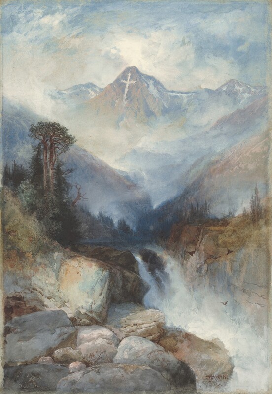 We look across a bank of large boulders that give way to a waterfall in the middle distance, behind which a towering mountain marked with a white cross rises near the top of this vertical watercolor landscape. Painted with swirling washes of topaz and powder blue, cream white, and some touches of pale golden yellow, the central mountain ascends amid the clouds that settle around the peaks to either side. Slivers of white along the central and neighboring mountains echo the white cross, which seems to have been made with fallen snow on the face of the central peak. Clouds or fog eddying around the neighboring peaks make the middle distance hazy. Closer to us, some scrubby pine-green trees line a riverbank that feeds a waterfall in the lower third of the composition. The water falls behind the slate-gray boulders hulking in the lower left corner of the paper. A bird flies in the mist near the falls.