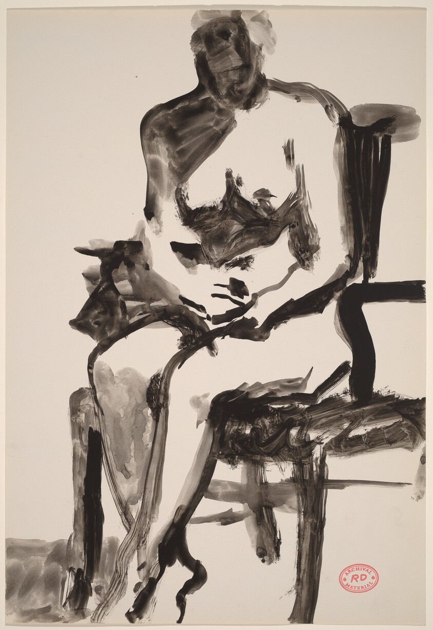 Untitled [female nude seated in armchair]