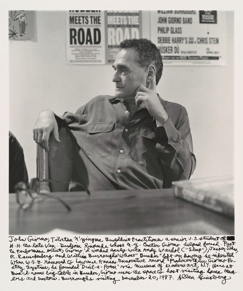 John Giorno, Tibetan Nyingma Buddhist Practitioner a senior U.S. student of H.H. the late Ven. Dudjom Rinpoche whose N.Y. Center Giorno helped found. Poet & Performance Artist, Giormo'd worked early with Andy Warhol ("Sleep") , Jasper Johns, R. Rauschenberg and William Burroughs whose "Bunker" loft on Bowery he inherited when W.S.B. removed to Lawrence Kansas. Innovative record producer through Giorno Poetry Systems, he founded "Dial-a-Poem" via Museum of Modern art, N.Y. Here at Board-room big table in Bunker, Giorno uses the space to host visiting Roma teachers and Doctors. Burroughs visiting December 20, 1987.