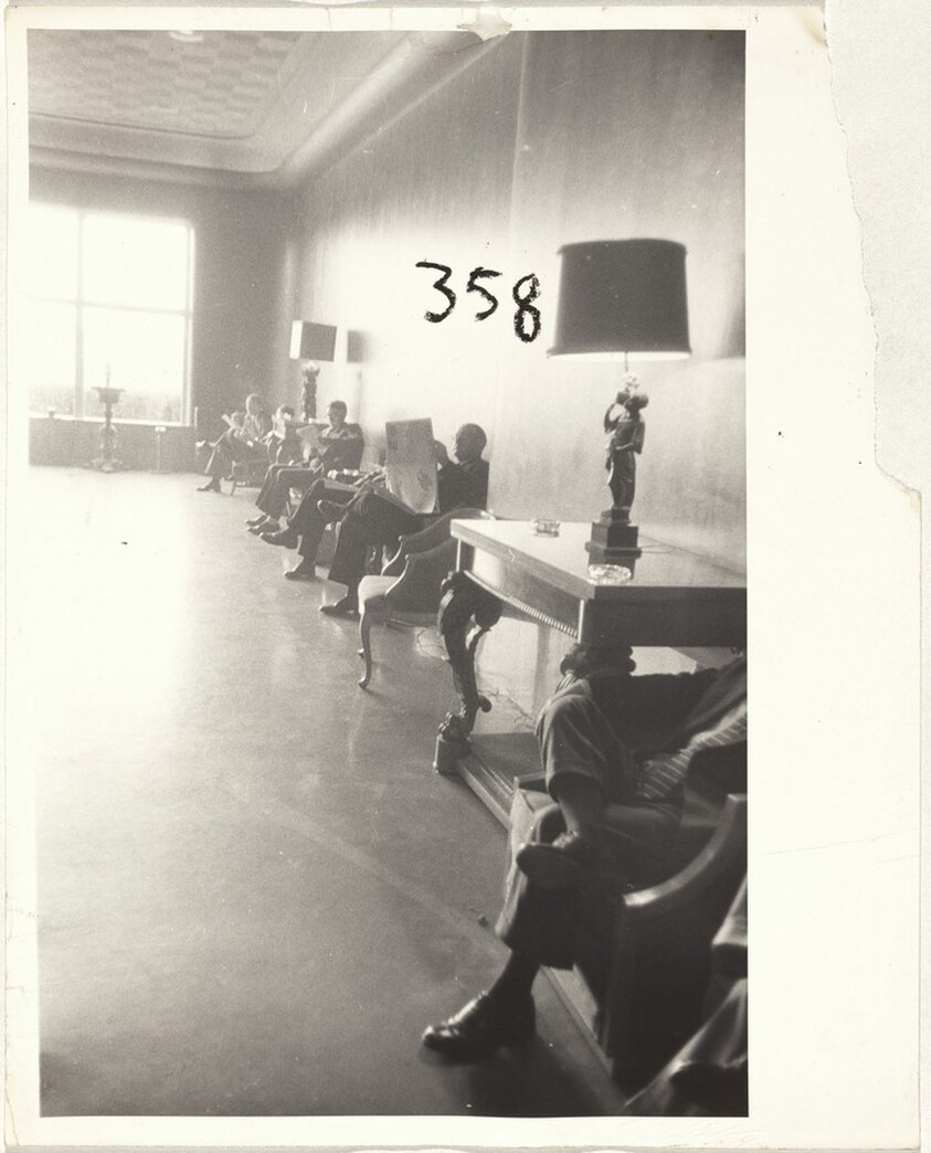 Men seated in lobby--Houston, Texas