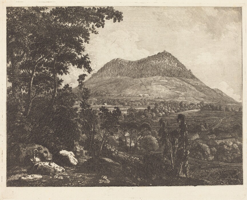 The image depicts a landscape scene with a valley, mountain, trees, rocks, cultivated fields, and forested areas. The mountain is detailed with etching strokes, showcasing rocky terrain and clustered vegetation near the summit. The artwork utilizes cross-hatching and fine line work to create textures and shades. The color scheme is monochromatic, focusing on light and dark contrasts for depth. Trees, rocks, and various landscapes are seen in the foreground, while a sky with clouds is softly rendered in the background.
