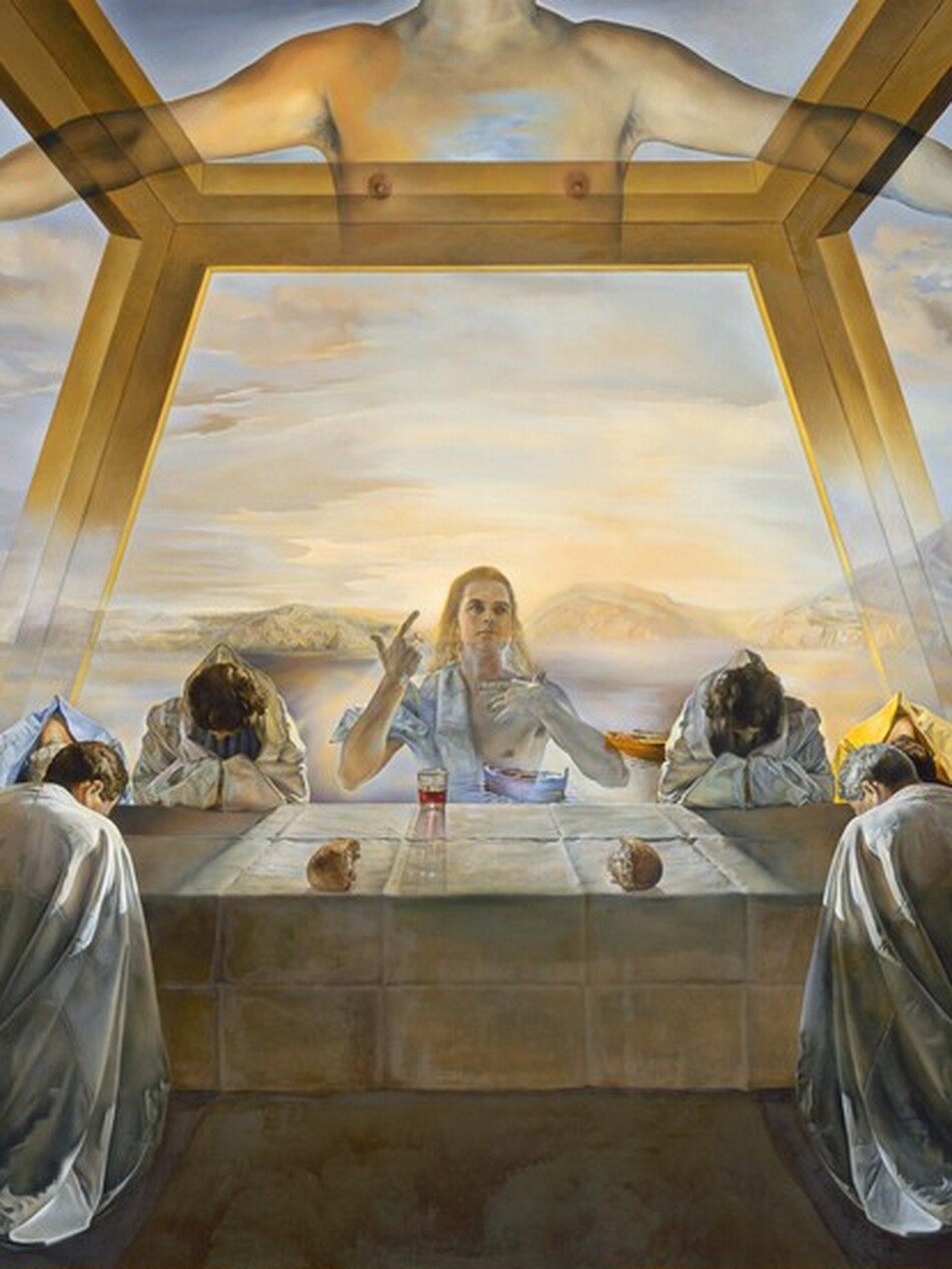 One transparent, ghostly man sits and twelve more people wearing long robes bow over a long table set under a floating, surreal structure in front of a watery landscape in this horizontal painting. The people all have light or tanned skin. At the center of the table opposite us, a man, Jesus, sits facing us with his left hand, to our right, touching his chest and his other hand raised with the thumb and index finger pointing upward. He has long, blond hair, dark brows, and his square jaw is cleanshaven. A piece of white drapery wraps over one shoulder so half of his chest is bare. His body is outlined with light but is transparent so we see the landscape beyond the table through him. Three men are spaced evenly, shoulder by shoulder, to each side of Jesus on the far side of the table. A pair of men sit at each narrow end, and two men sit on our side of the table, one to either side of Jesus. The men on our side kneel at the table, so presumably the rest do as well. They bow their heads low over their praying hands, which rest on the table. Ten of the men wear silvery-white robes. One man to our left wears a lapis-blue cloak and one to our right wears bumblebee yellow. Eight of the men have dark hair, three have gray hair, and one is blond. The table spans the width of the painting, with the short ends to each side receding sharply back in space so there is room for the men there. The parchment-white cloth covering the table is creased deeply where it had been folded. Two pieces of a round loaf of bread, torn in half, are to either side of Jesus near the edge of the table closer to us. A glass tumbler with red liquid sits near Jesus. The scene is lit from the landscape beyond the table, so the people are slightly backlit, and the shadows and the red glow from the glass extend toward us. A structure above the table is suggested by a floating form of interlocking, golden shapes, like an oversized honeycomb, to create a dome-like space. Coffee-brown areas at the upper corners of the painting suggest a ceiling, but the structure fades to transparency as it nears the table. A shimmering body of periwinkle-blue water stretches from behind the table to a row of low, gossamer-white, rocky mountains along the horizon in the distance. One empty, golden yellow rowboat floats in the water, seen past Jesus's left elbow, and a second, indigo-blue boat has been pulled onto a sandy shore to our left. The sky above is topaz blue around a warm, yellow glow emanating from Jesus. A few taupe and cream-white clouds float across the sky. The artist signed the painting in dark brown on the tablecloth in the lower right: “Gala Salvador Dali 1955.”
