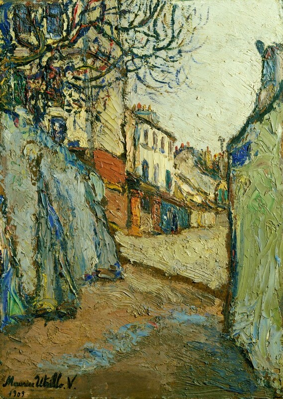 A street stretches away from us between two walls to a town in this vertical, loosely painted landscape. Thick, textured brushstrokes are visible throughout. The pavement directly in front of us is camel brown with a pale blue squiggle suggesting a puddle. The wall to the right is celery green, and a bright blue sign is at the top, far corner. The wall to the left is buttressed and is painted in shades of sky and lapis blue. The road beyond the path is parchment brown, and three and four-story buildings lining the left side of the road are painted in tones of burnt orange, butter yellow, denim blue, and off white. Branches of a tree growing over the wall to the left are painted with curling strokes in olive green and royal blue, and the sky is very pale, yellow-tinted green. The artist signed and dated the painting in the lower left corner, “Maurice Utrillo.V. 1909.”