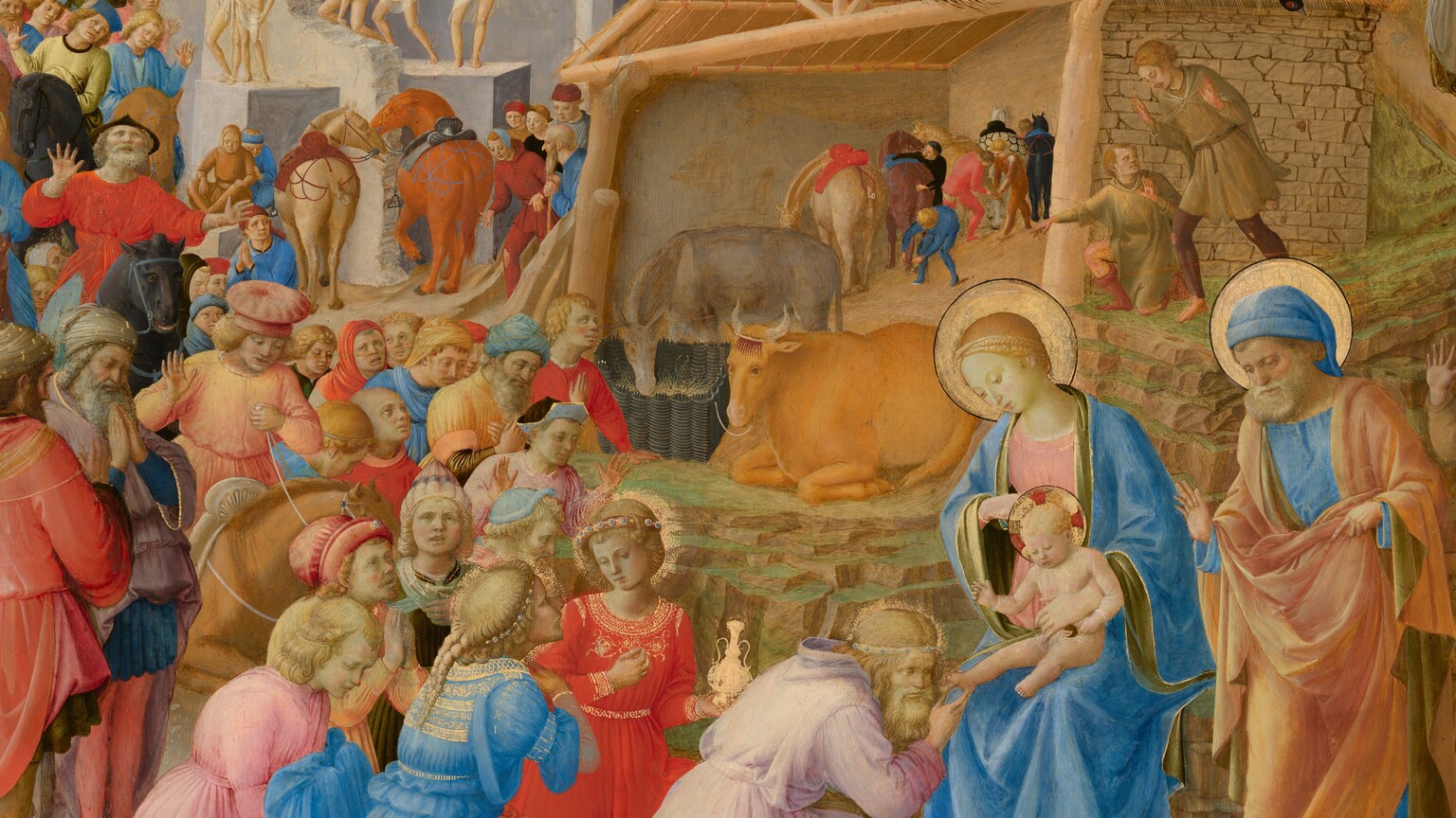 Dozens of people line up around a shed-like structure and around stone ruins to kneel before a woman and baby at the lower center of this circular painting. All the people have pale skin. The crowd gathers along a pathway that winds around a rocky mountain at the top middle of the composition. Most of the people are on foot but a few ride horses or camels. The line of people curves around and through an arched opening in a stone ruin to our left. Sitting at the center of the painting, behind the woman and baby, Mary and Jesus, the structure is open at the front and has a triangular pitched roof. Some of the people, including the three closest to Mary and Jesus, wear elegant, gold-trimmed clothing. Others wear simple tunics, and several people standing along the ruins in the middle distance wear only white loincloths. Ages of the people range from young and cleanshaven to older and bearded. Their costumes are mostly pale yellow, coral orange, crimson red, shell pink, or sky blue. Some people raise their heads and hands while others hold hands to their chests and close their eyes. Mary wears a pale blue robe over a blush-pink dress. Jesus is nude and an older man standing nearby wears an apricot-colored robe over a blue tunic. The older man, Mary, and Jesus have gold halos. A peacock and two other birds stand on the roof of the manger, which shelters an ox, ass, and horses.