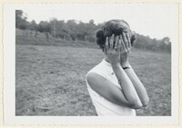 Untitled (Woman with hands over face in field), American 20th Century, 1950s
