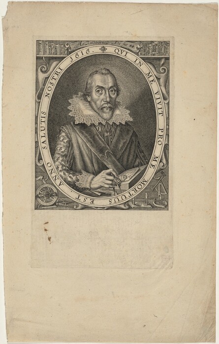The image shows a portrait of a man from the waist up. He is facing slightly to the left, looking directly at the viewer. The man has a pointed beard, mustache, and graying hair combed back. He wears an elaborate costume with a lace ruff collar, patterned sleeves, and a striped outer garment. In his right hand, he holds a quill pen, with an open book on the table in front of him. Various instruments are on the table. The background has an ornate frame with Latin inscription and decorative elements. The engraving is monochromatic with fine lines and shading for texture and depth.