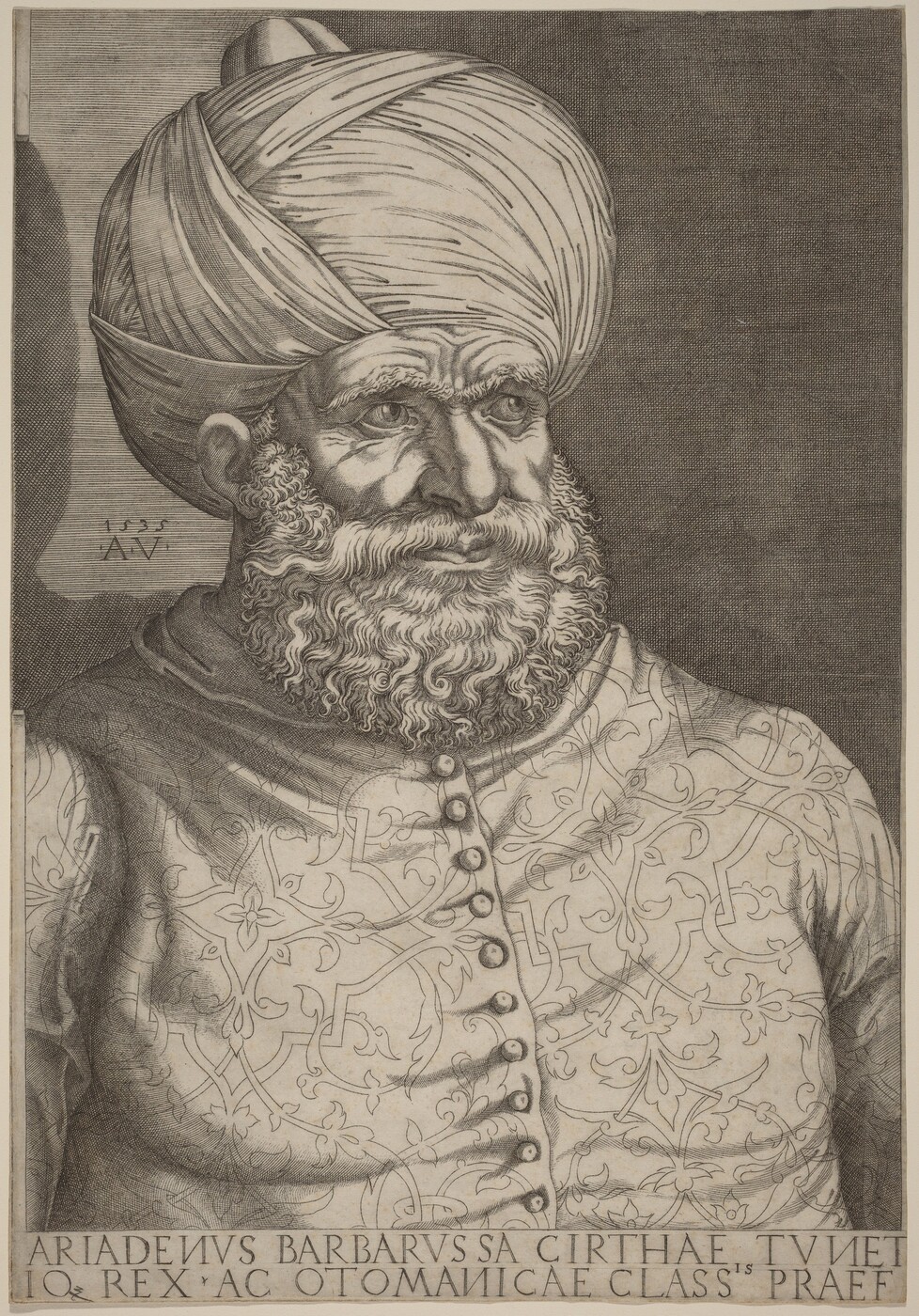 The image shows a drawn portrait of a bearded man. He is in a slightly turned position, facing right. His face is detailed with deep-set eyes, strong eyebrows, prominent nose, and full lips, surrounded by a thick, textured beard and mustache. He wears a large turban covering his head. The man is dressed in a richly patterned garment with buttons along the front. The background is dark and textured. There are no visible jewelry pieces or objects held by the man. The lower portion of the image includes an inscription.