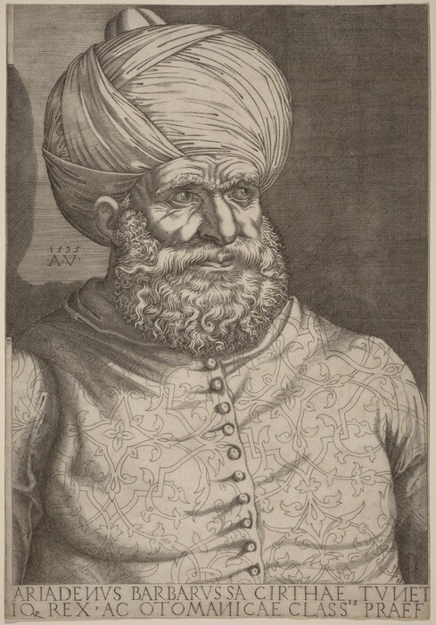 The image shows a drawn portrait of a bearded man. He is in a slightly turned position, facing right. His face is detailed with deep-set eyes, strong eyebrows, prominent nose, and full lips, surrounded by a thick, textured beard and mustache. He wears a large turban covering his head. The man is dressed in a richly patterned garment with buttons along the front. The background is dark and textured. There are no visible jewelry pieces or objects held by the man. The lower portion of the image includes an inscription.
