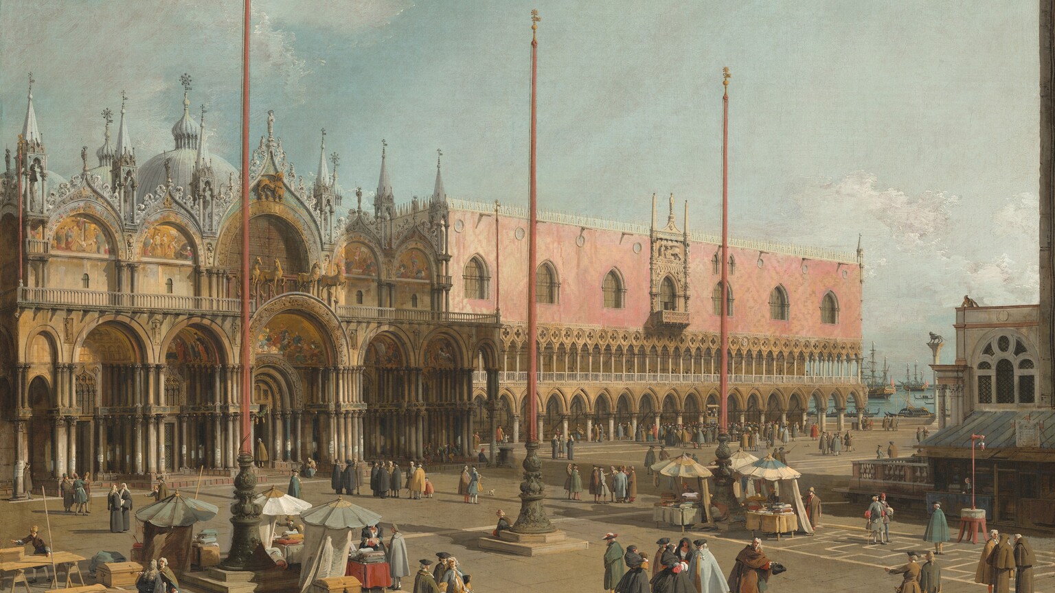Dozens of men with several women and a few children gather in pairs or small groups across a sun-drenched plaza in front of a domed church next to a long, pale pink building in this horizontal painting. The people’s faces and hands we can see have pale, peachy skin. The men wear hats and shin-length capes or jackets over stockings in tones of charcoal gray, olive green, butterscotch yellow, black, and brown. The women wear black capes covering their heads and long, full skirts. The ash-brown plaza has two zones where geometric patterns are picked out in a lighter, oatmeal brown. Three coral-red flagpoles are spaced along the center of the plaza parallel to the two buildings. Each flagpole rests on an olive-green base about a third of the height of the pole. Tables under open umbrellas clustered around the outer two flagpoles display piles of cloth, and a few people gather around the wares. The domed building extends into the scene from the left edge of the painting, and reaches about a third of the way across as it angles away from us. It has a central portal with nested arches, flanked to each side by a pair of slightly smaller, arched portals. Scenes against gold backgrounds appear in the archway of each of the five doors. There is a second level of arches above. The smaller arches to either side are decorated with more scenes of people against gold backgrounds. Four gold horses stand atop the central, lower arch, each with one front and one back hoof raised. The arch behind them is dim, the back side of a stained-glass window. The stone of the arches and front of the building are light brown. The upper arches are lined with pale, slate-gray spires and curling tracery. The three-story pink building sits close by to our right, extending into the distance on the same angle as the church, and as tall as its neighbor. The lowest level is a series of open, pointed arches. The second level is also a row of arches, but more closely spaced. People walk and stand under both covered walkways. The top half of the building has a carnation-pink façade with seven windows evenly spaced across its width. The central window is surrounded by carved stone ornament. Along the right edge of the painting and closer to us than the large buildings is the corner of a two-story building. The lower level is in shadow under a sloping awning, creating a merchant’s stall, and the second level has a rounded, arched window. One person stands at the front corner of the roof and looks down into the square. In the narrow gap between the row of buildings to our left and the smaller structure to our right is a winged lion atop a tall column. Beyond that is sparkling blue water with several masted ships and long, narrow gondolas. The sky above has thin white clouds against a pale blue sky. The artist signed the lower left, “A.C.F.”