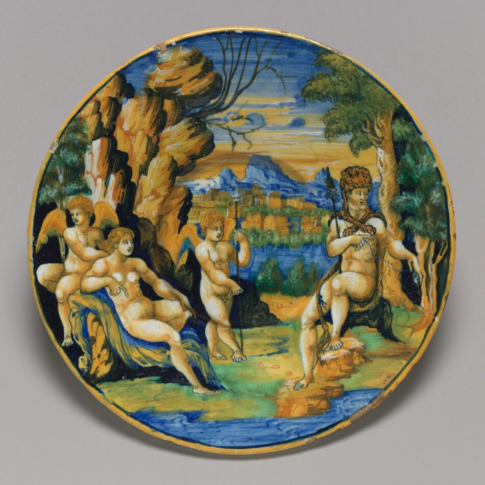 This is a painting of an outdoor scene with mythological figures. The artwork depicts a group of nude, winged figures relaxing in a lush landscape, with a distant view of a classical city beneath a sky tinged with sunset hues. In the foreground, trees and rock formations frame the mythological figures, who are adorned with rich colors and intricate details. The central sitting figure plays a pipe. The artist uses vivid colors like blues, greens, and earth tones. This is in the style of Giorgio Andreoli, known for his work with majolica ceramics featuring mythological and idyllic themes.