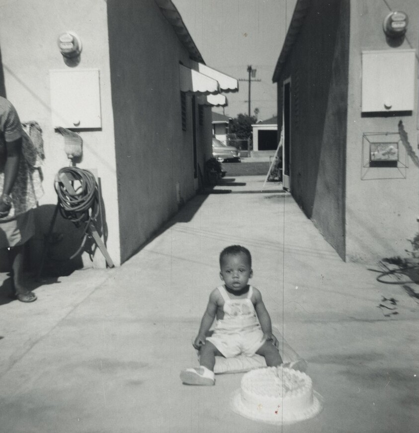 Untitled (Boy sitting with birthday cake)