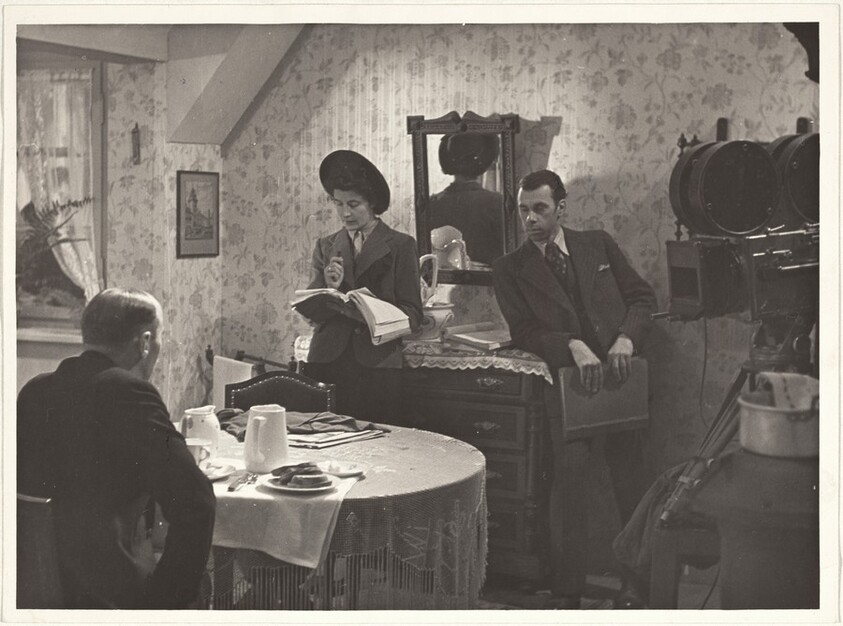 Actors around table--Filming