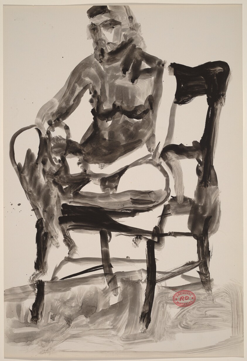 Untitled [female nude seated in a highback chair]