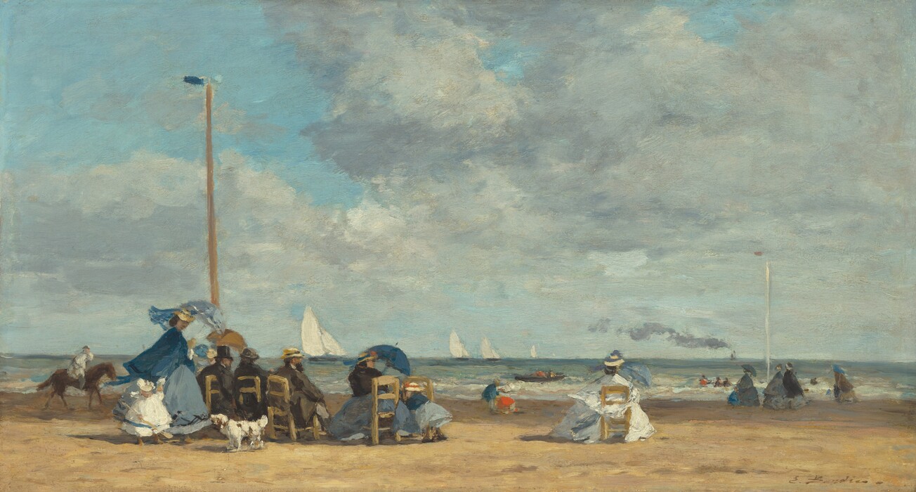Eight men, women, and children stand or sit in straight-backed, wooden chairs gathered along a sandy beach near low, gently breaking waves with sailboats floating in the ocean beyond in this horizontal landscape painting. The scene is loosely painted throughout, making much of the detail indistinct. Most of the people sit with their backs to us but the faces we can see suggest they have light skin. The people gather in a loose crowd that spans the left half of the composition, except for one woman wearing white and holding a blue parasol who sits to the right. The women wear long dresses with full skirts in shades of black, aquamarine or arctic blue, or snowy white. They all wear straw-colored hats with royal-blue bands. The three men also wear hats and suits in black or pecan brown. Two women, in addition to the one sitting alone, hold up blue parasols. One child wears a white dress and hat, and the other wears shades of blue and a straw hat with a red band. A white dog with brown spots stands on our side of the chairs near a woman and the child wearing white. One tall, wooden pole with a blue banner rises high above the crowd near the left edge of the composition, and another with a red pennant is farther back to the right. Between the group and the water, a person rides a brown horse, several women walk, and two children play in the sand. A rowboat is near the breaking waves and five white sailboats line the horizon, which comes about a quarter of the way up this painting. A steamship leaves a line of muted lilac-purple smoke in the deep distance to the right. A blanket of pale gray clouds cover much of the bright blue sky. The artist signed the lower right corner, “E. Boudin.”