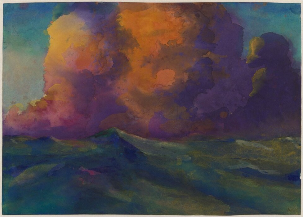 Waves painted with strokes of sapphire blue and muted emerald green surge across the bottom third of this horizontal watercolor. The top two-thirds are dominated by towering piles of clouds painted in violet purple and marigold orange. The sky above around the clouds is shaded with turquoise and soft blue. The artist signed the lower right corner, “Nolde.”