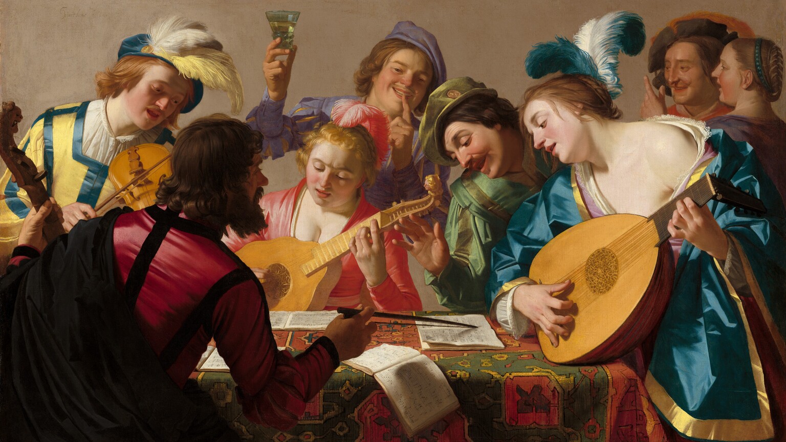 This horizontal painting shows a group of eight light-skinned musicians and onlookers gathered closely around a rectangular, carpet-covered table. The front edge of the table runs parallel to the bottom edge of the painting, and seems close to us. Shown from about the waist up, the men and women’s vivid lapis-blue, coral-red, buttercup-yellow, lilac-purple, and moss-green garments fall in crisp folds. Bright reflections on the fabric suggest a satin-like material. Two women wear feathers in their hair and one man’s hat is plumed. One man, wearing crimson red and black, sits with his back to us to our left on the near side of the table. He holds the neck of a bass viol, about the size of a cello, with his left hand, and points to pages of an open music book with the bow in his right hand. The other people cluster on the far side of the table. A man to the left plays a violin; a woman at the center plays a guitar-sized bandora, and a woman to our right plays a lute. The musicians, along with a man who leans over the table from between the two women, look down at the music books. A young man behind the woman at the center holds up a glass of pale liquid with his right hand as he touches his left forefinger to his smiling lips. A man and woman stand close together in the background to our right, in the top right corner of the canvas.