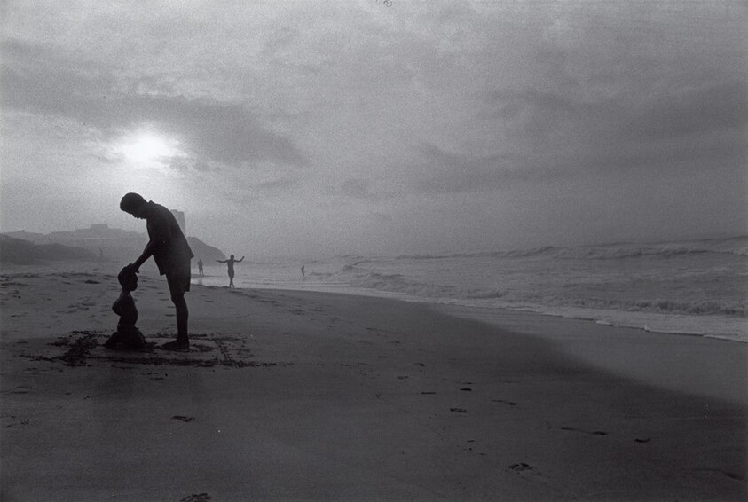 Father Prays over Son on Osu Beach,  Accra, Ghana