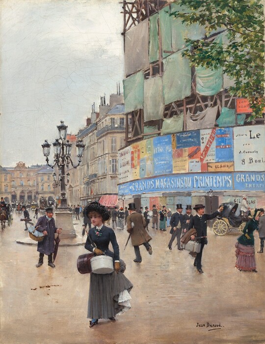 Dozens of pale-skinned men and women, mostly wearing black and charcoal gray, walk or ride in horse-drawn carriages through a busy street lined with buildings in this vertical painting. Most of the people are men, and most of them wear thigh- or knee-high coats and black top hats. A few wear navy blue, brown, or gray, but most are in black. The few women wear long skirts under tight, narrow-waisted bodices, gloves, and hats. The person closest to us, to our left of center, is a woman in a midnight-blue jacket, brown gloves, and a black hat. She holds two round hat boxes, one white and one black, in one hand with a closed umbrella tucked into that elbow. With her other hand she holds up her skirt to reveal a cascade of a white petticoat over a touch of sky-blue stocking within a black shoe. Pink flowers and green leaves, like a narrow corsage, is affixed to the front center of her jacket. Other people carry umbrellas, packages, boxes, or travel cases. The street surface is tan streaked with some touches of smoke gray. A streetlamp a short distance from us, to our left of center, has a central lantern above four more lanterns emanating from the central pole like the arms of a candelabra. The streetlamp sits on tall pedestal surrounded by a curb. The row of buildings lining the streets is closest to us to our right, and it extends into the distance as it angles to our left. Then, along the left edge of the painting, another row of buildings cuts across the street and encloses our view. On the street corner closest to us, posters in shades of butter yellow, white, topaz blue, brown, and red are plastered over a storefront that curves around a corner to our right. A long sign runs across the top of the storefront with white letters against a pale blue background. It reads, “GRANDS MAGASINS DU PRINTEMPS GRANDS ENTRÉE.” Above it a sign reads “Le” and “8 Boul” before being cut off by the right edge of the composition. Scaffolding above the signs is covered with cloths in pale laurel green and parchment brown. Buildings in oatmeal-brown stone with gray roofs extend into the distance to our left. The building facing us far down the street has arched openings along the ground level beneath two stories of windows. The sky in the upper left quadrant is painted with blended strokes of light, arctic blue and white. The artist signed the painting near the lower right corner, “Jean Beraud.”