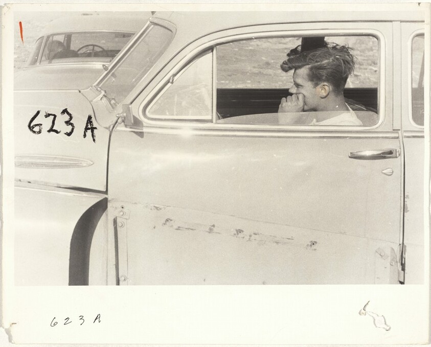 Man seated in automobile--San Francisco