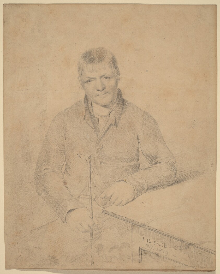 Man Seated at a Table