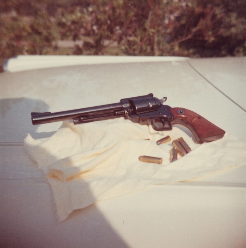 Untitled (Gun on the car)