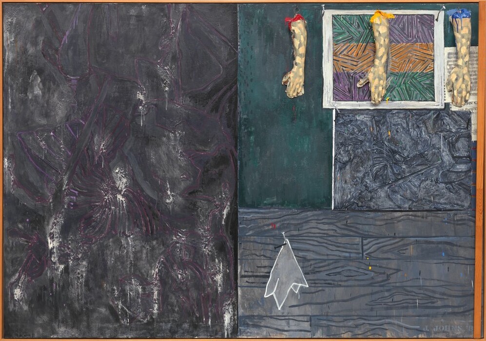 Three casts of human hands and forearms hang from the top edge of the right half of this horizontal abstract painting, which is divided vertically in two equal parts. The rectangular field to the left is mottled with steel and charcoal gray streaked with white and amethyst purple. The panel to the right is divided again so the top half is slightly larger than the bottom half. The bottom portion is painted with a pattern to resemble abstracted wood grain in nickel and slate gray. A stylized white cloth, perhaps a handkerchief, is painted to look as if hanging from a nail hammered into the wood paneling, to our left. The top portion seems to be layered with paintings and prints below and beneath the three arms. The three-dimensional arms hang from looped metal wires on metal hooks spaced along the top edge, coming about a quarter of the way down the overall composition. The peach-colored arms and hands are painted all over with irregular gray patches, creating a camouflage effect. They hang down so the open palms are flat against the canvas, the thumbs extended to our left. The top of the arm to our left is painted cherry red, the middle is painted canary yellow, and the right arm royal blue. The paint drips down the arms and splatters on the hands and on the faux wood panel below. Behind the hands, it appears that one of the artist’s prints hangs from two nails on the canvas, but this is also part of the painting. The illusionistic print has three horizontal bands of pine green, pumpkin orange, and violet purple crisscrossed with black lines. Seeming to hang behind it and under the right-most arm is a sheet of music overlapping another piece of paper printed with the letters “OHN C” and “THE PERILOUS.” Below, and filling the space between the illusionistic print and the wood panel, is a rectangular field of abstract gray and black swirling forms. The entire canvas is surrounded by a thin, amber-colored wood frame. A narrow wooden slat is attached with a hinge on the inner surface of the frame at the bottom right corner, so the slat runs up along and rests against the canvas near the rightmost edge of the frame. The artist signed the work with stenciled letters in pale gray in the lower right corner: “J. JOHNS ‘8.”
