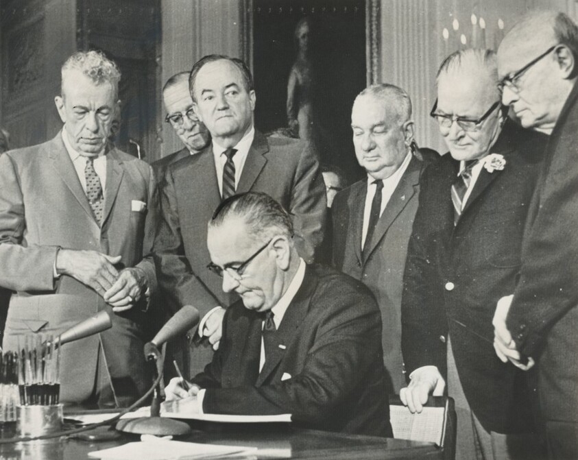 Title from caption on object: “The Civil Rights Bill Was Signed by President Johnson...”