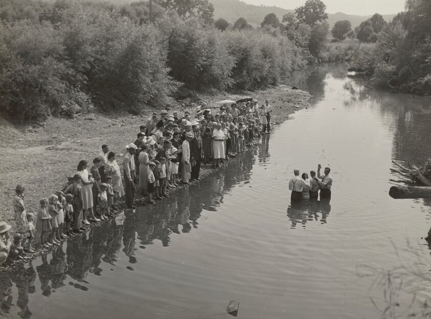 Members of the Primitive Baptist Church in Moorehead, Kentucky, attending a creek baptizing by submersion