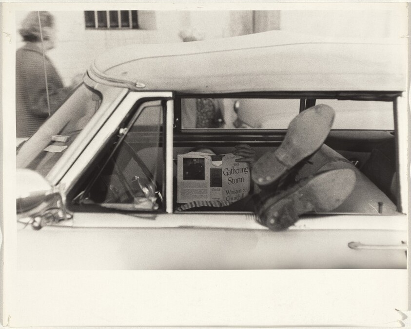 Man reading in automobile--Los Angeles