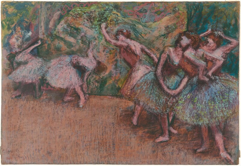 Six pink-skinned ballerinas stretch of practice in this horizontal pastel drawing. The scene is roughly sketched so some details, like the women’s faces, are indistinct. They all have brown hair and costumes with sleeveless bodices and knee-length tutus. Three dancers cluster close to us. Two at the front have tutus shaded with peacock blue and amethyst purple and dotted with spring green. The bodices of these two and the one standing behind them are copper orange. The woman to our right holds both hands to the small of her back. Another touches her hair with both hands, and the third stands with her feet apart in fourth position, toes pointing outward, and hands clasped gracefully down in front of her. The other three dancers wear pale pink bodices and tutus that match the color of their skin. Taking up the left half of the composition and moving slightly back in space, one dancer leans forward with one arm raised, and the other two bend double to brush one hand by their feet. The floor is tawny brown. The background is loosely drawn with strokes of lime green, pale pink, teal blue, and sand brown. The artist’s name appeared in the lower left corner, “Degas.”