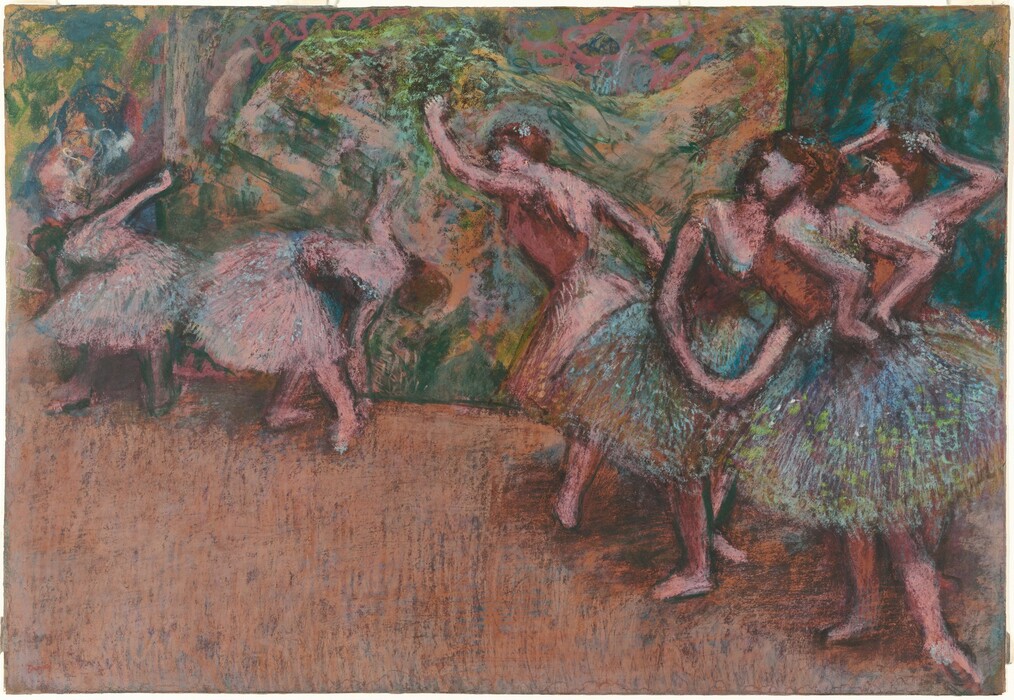 Six pink-skinned ballerinas stretch of practice in this horizontal pastel drawing. The scene is roughly sketched so some details, like the women’s faces, are indistinct. They all have brown hair and costumes with sleeveless bodices and knee-length tutus. Three dancers cluster close to us. Two at the front have tutus shaded with peacock blue and amethyst purple and dotted with spring green. The bodices of these two and the one standing behind them are copper orange. The woman to our right holds both hands to the small of her back. Another touches her hair with both hands, and the third stands with her feet apart in fourth position, toes pointing outward, and hands clasped gracefully down in front of her. The other three dancers wear pale pink bodices and tutus that match the color of their skin. Taking up the left half of the composition and moving slightly back in space, one dancer leans forward with one arm raised, and the other two bend double to brush one hand by their feet. The floor is tawny brown. The background is loosely drawn with strokes of lime green, pale pink, teal blue, and sand brown. The artist’s name appeared in the lower left corner, “Degas.”