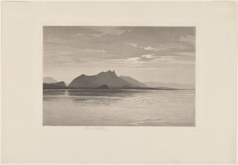 The image shows a body of water with mountains in the distance. The horizon is in the middle of the image, with mountains rising from it. The scene has a soft appearance with smooth tones and a monochromatic color palette of varying shades of gray. The water is calm with ripples reflecting light, and the sky has scattered clouds.