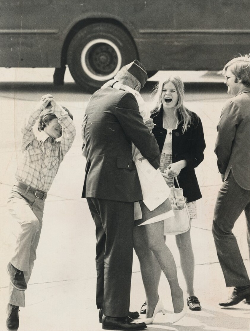 Title from caption on object: “Colonel Laird Guttersen, Air Force, Hugs Wife Virginia at March AFB in Riverside, California...”