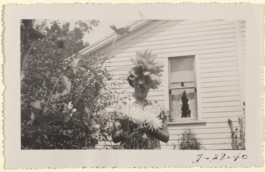 Untitled (Woman with flower in front of head)