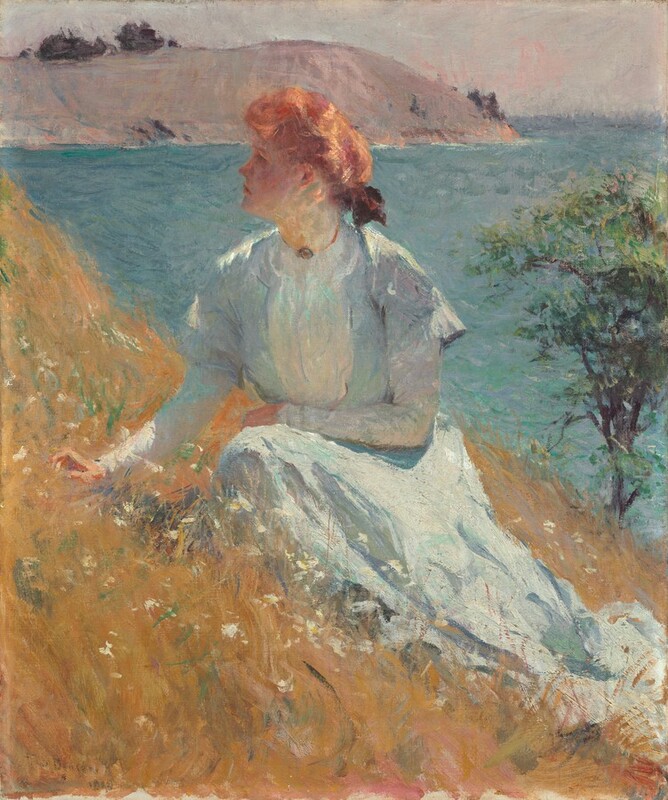 A pale-skinned woman wearing a long dress sits on a golden-brown grassy hillside in this vertical portrait painting. The scene is loosely painted with visible brushstrokes throughout. The hill creates a steep diagonal angling down from near the top left corner to the right edge, just over the lower corner there. The woman sits with her knees facing us as she looks up and off to our left in profile. She is lit from our right so her face is in shadow, but she has delicate features. The light warms her copper-red hair, which is tied with a bow at the back of her neck. Her ice-blue dress has a high collar, long sleeves, and a full skirt that puddles in the grass. She rests her left arm, to our right, across her midsection, and holds her other hand just over the grass. White flowers dot the hillside, which slopes down a single tree in the near distance along the right edge of the canvas. Ultramarine-blue water beyond ripples back to a flat-topped, smoky-mauve outcropping. A sliver of oyster-white sky lines the horizon, which comes almost to the top of this composition. The artist signed the painting in the lower left corner, “F.W. Benson.”