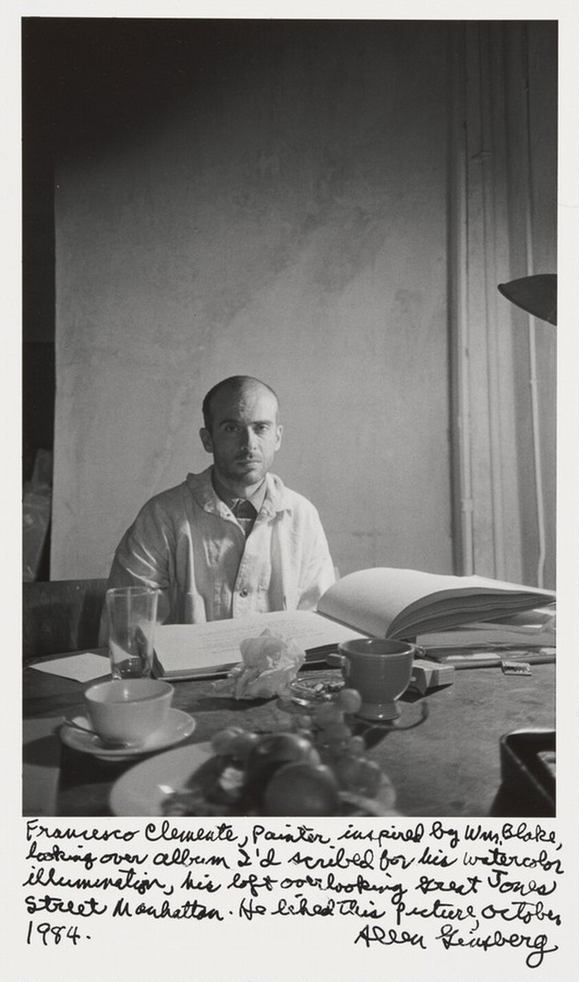 Francesco Clemente, painter inspired by Wm. Blake, looking over album I'd scribed for his watercolor illumination, his loft overlooking Great Jones Street Manhattan. He liked this picture, October 1984