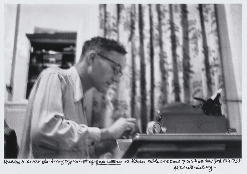 William S. Burroughs fixing typescript of _Yage Letters_ at kitchen table 206 East 7th Street New York Fall 1953.