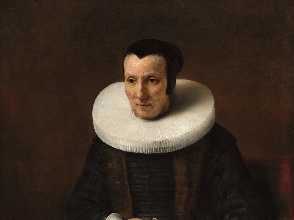 Shown from the knees up, a pale-skinned woman wearing a black dress with white cuffs and a wide, starched collar sits in a wooden chair against a dark brown background in this vertical portrait painting. Her body faces us and she looks off to our left with brown eyes. She has slight jowls at her chin and her eyes, mouth, and forehead are lined. Her hair is pulled back under a close-fitting black cap. Extending straight from around her neck, her white collar is pleated into narrow figure-eights and nearly reaches her shoulders. She wears a brown stole over her velvety black dress, and both nearly blend with the dark background. She holds a pair of pince-nez spectacles in her right hand, which rests on a thick book in her lap. The spine faces her right, and the opposite edge is fastened with metal clasps. A braided cord affixed to the narrow end of the book near us creates a loop.