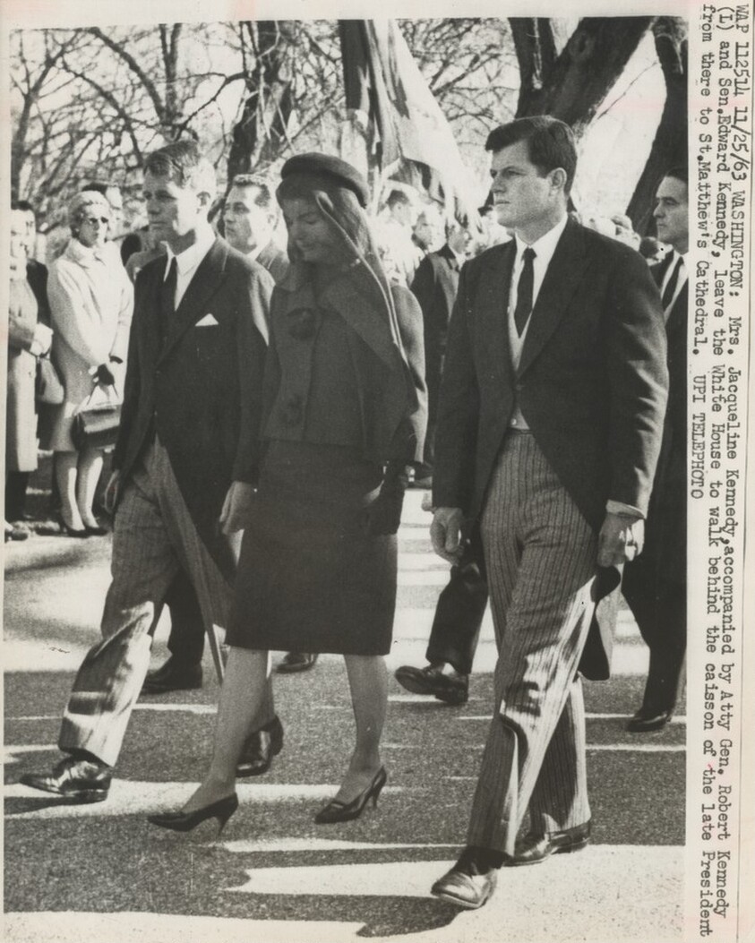 Title from caption on object: “Mrs. Jacqueline Kennedy, Accompanied by Attorney General Robert Kennedy and Senator Edward Kennedy...”