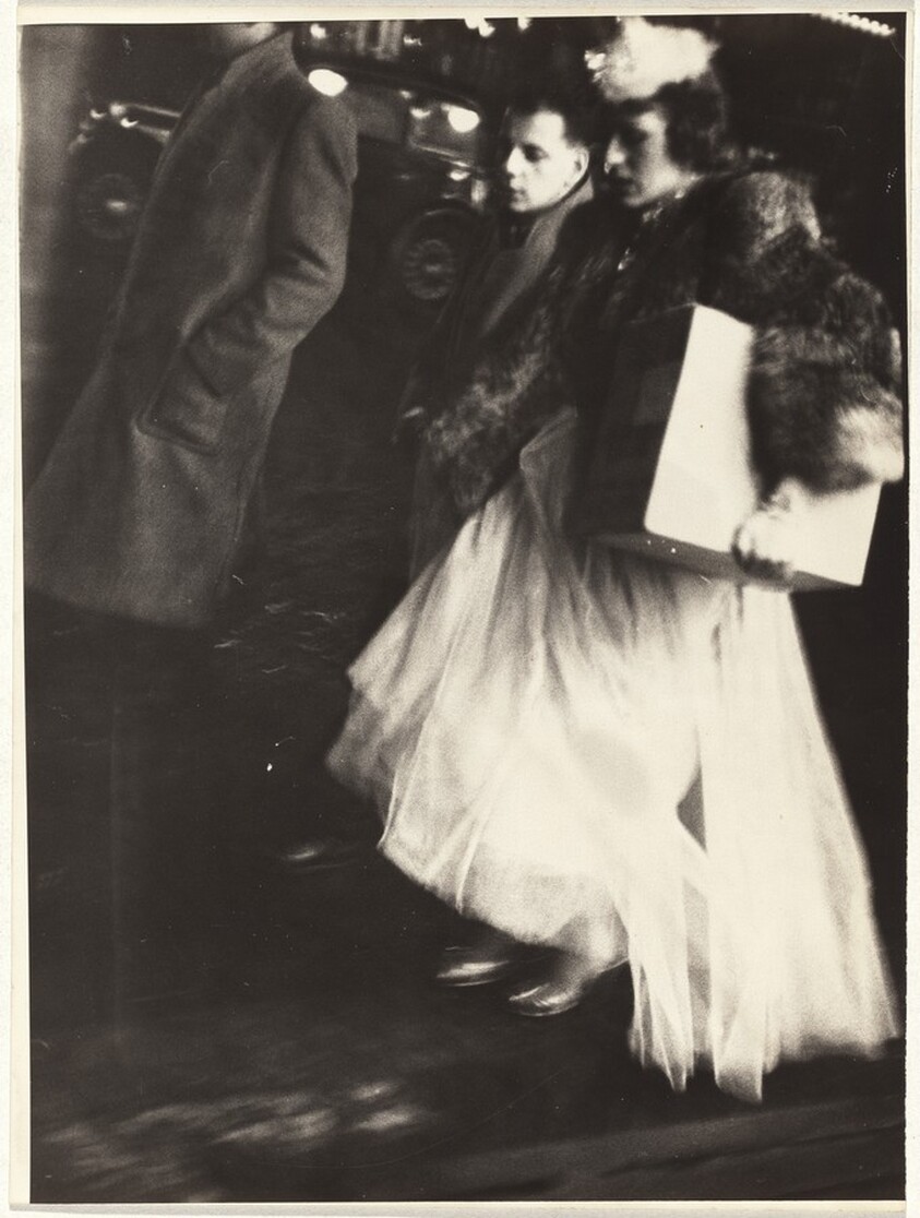 Woman in evening wear carrying box, Paris