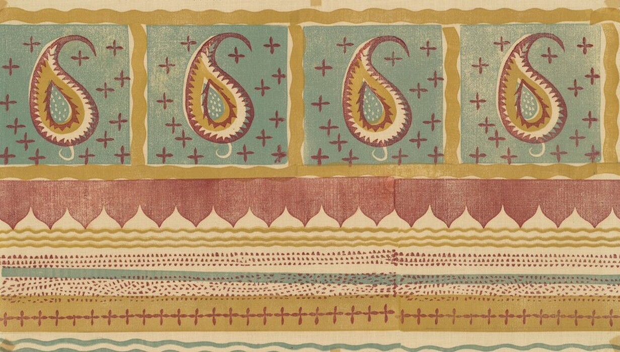 The image features a series of abstract patterns composed of teardrop-shaped swirls within rectangles, surrounded by small cross-like symbols on a teal background. The pattern includes alternating sections of maroon, golden brown, and cream hues that form horizontal bands, resembling a patchwork quilt. The swirls are bordered by wavy lines and dots that mimic the look of embroidered fabric.