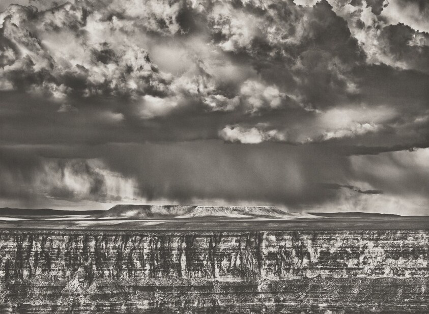 The Grand Canyon viewed from National Forest, Arizona. The big mesa visible on the far side of the canyon is in Navajo territory. This photograph was taken during a localized snowstorm. USA.