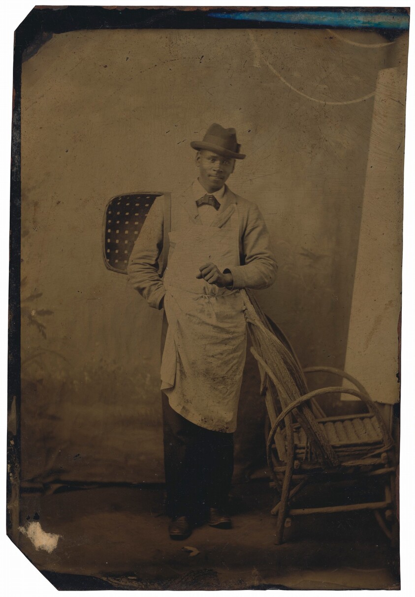 Portrait of a Man Holding a Basket
